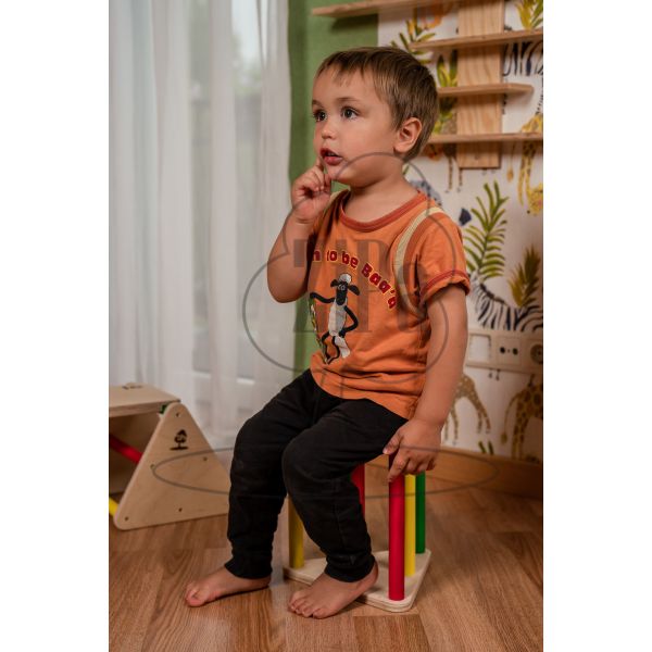 Child sitting on the Multifunctional Balance Constructor extra triangle