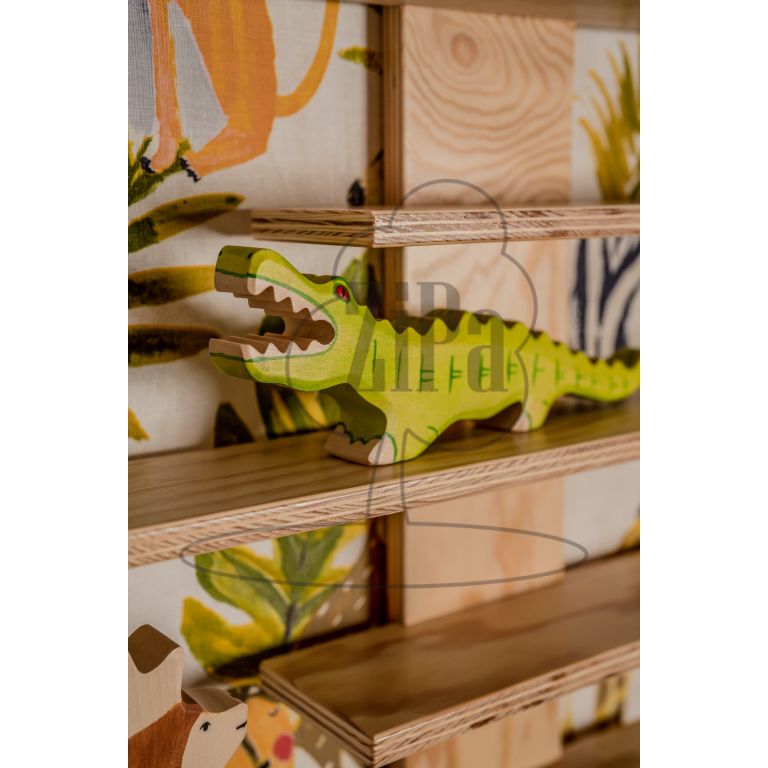 Toy shelf, close-up, with crocodile