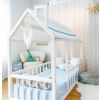 White Montessori bed for children, with round slats