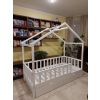 White house bed with modern canopy