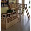 Varnished bunk bed for children and youth with a play area under the upper floor. Offset bunk bed with chest, overall view