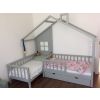 Corner bed with box in grey. Double bed for children with 2 chests under the right side of the bed and decorative wall with window. Picture at the customers.