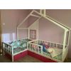 Corner bed with box in two colours, white and pink. Double bed for children with 3 chests and decorative wall with box. Picture at the customers.