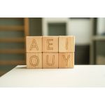 different letters on wooden blocks. English alphabet cubes. Set of wooden blocks.