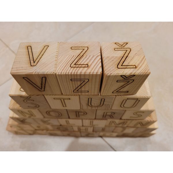 Latvian alphabet, displayed with wooden blocks. Wooden blocks, alphabet letters on blocks. Set of wooden blocks with Latvian alphabet. A Christmas present for children. Birthday present for babies.